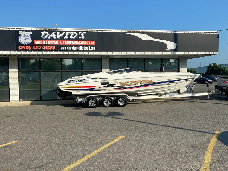 The shopfront with a customer's boat parked out front on its trailer